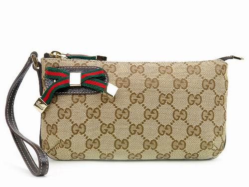 GUCCI-162846 蝴蝶結手拿化妝包咖啡色 - 20130227193458_922131730.jpg(圖)